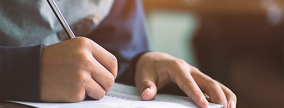 Man looking over the Most Frequently Asked Questions About Level II of the CFA® Exam