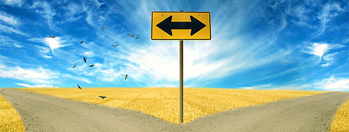 A sign showing a decision - CFA Charter verses CFP Mark