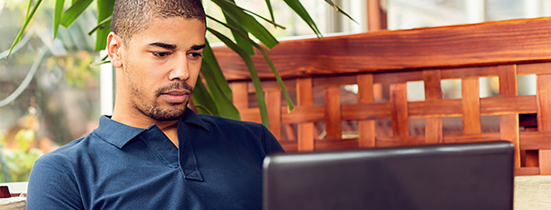 Man researching the difference between the Level 2 and Level 3 CFA exam