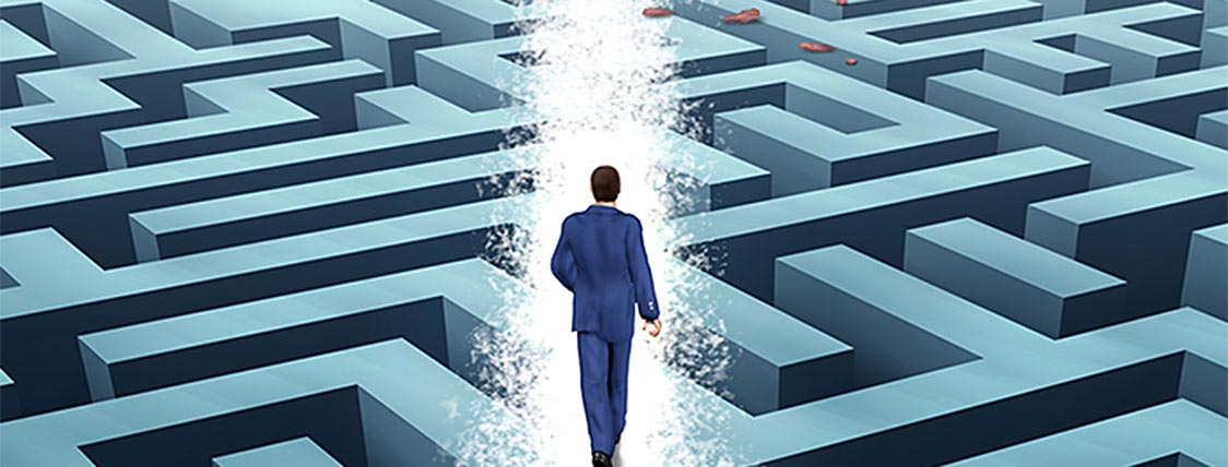 A Man progressing through a maze symbolizes designing a Strategy to Retake the CFA Exam