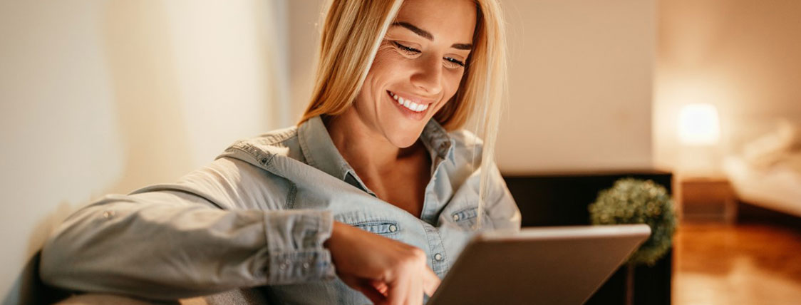 Woman holding tablet device image