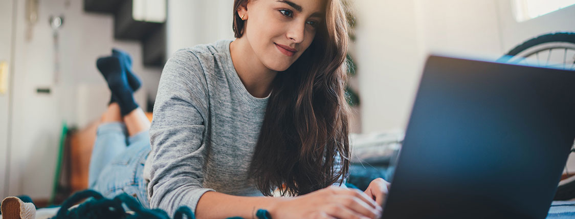 Woman working on a laptop in her home image