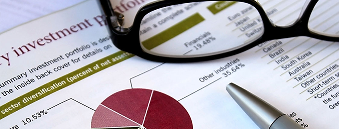Photograph of investment portfolio and other investment tools to answer: what is the CAIA designation?