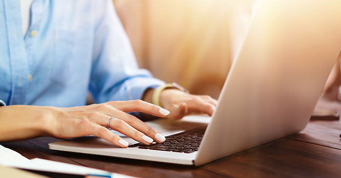 Kaplan Schweser - Woman on her laptop