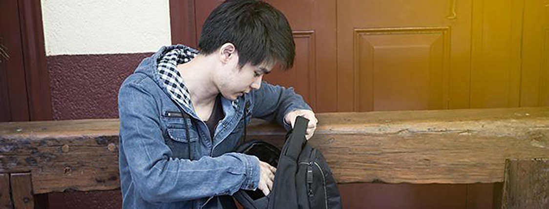 Student getting together everything he needs to take the CFA Exam