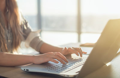 Student on a laptop using Schweser's FRM Free Trial